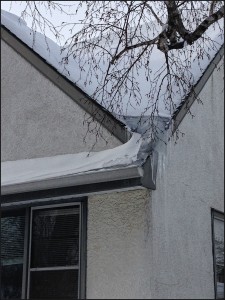 Ice dam in valley of roof