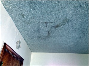 Ice dam damage on ceiling of home