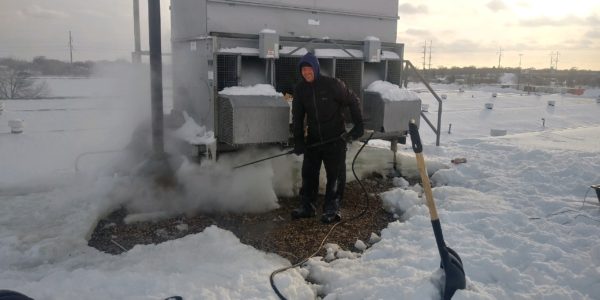 Removing Roof Ice From A Commercial Building