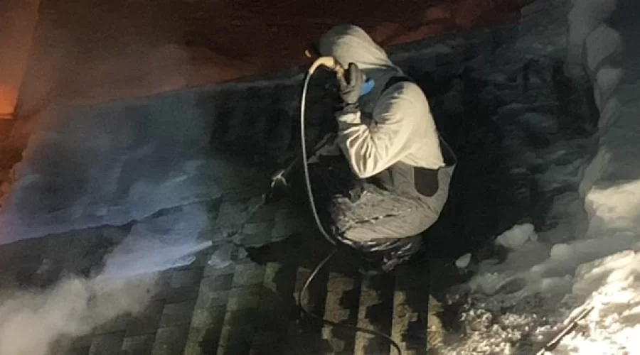 Removing snow and ice from roof with steam