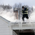 Steaming ice dam on roof in Lockport NY.