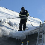 Removing ice dam with steam from roof near Buffalo, NY.