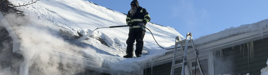 Removing ice dam with steam from roof near Buffalo, NY.
