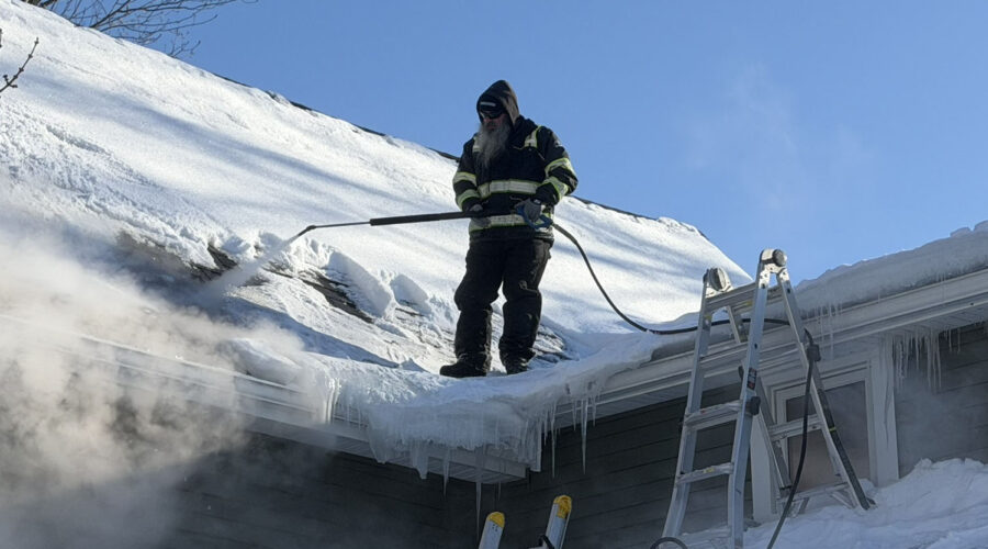 Removing ice dam with steam from roof near Buffalo, NY.